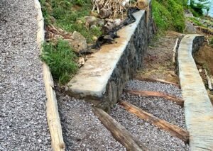 stairwell made of log steps and gravel winding uphill